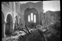 Bombed architecture, destroyed church with alter and Madonna standing