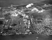 Aerial view of Eighth and Ninth Wards from the Mississippi River to Lake Pontchartrain, centered at Industrial Canal