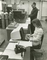Woman working at a computer 